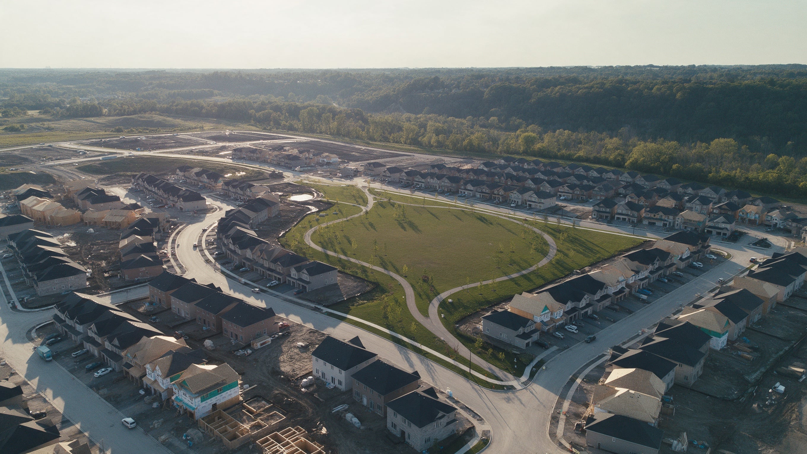 Aerial view of a master-planned community under construction near Bolton